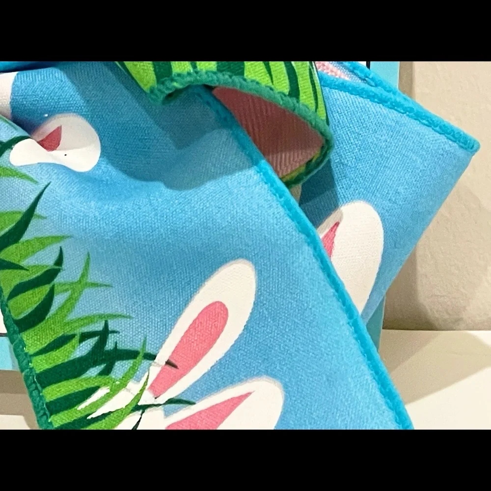 Large, colorful, double hair bow with bunny ears